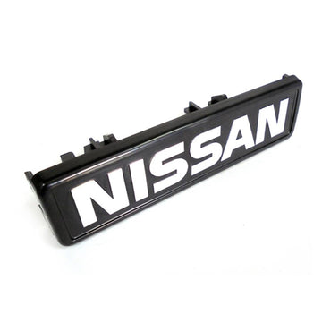 Emblema grelha frontal | Nissan