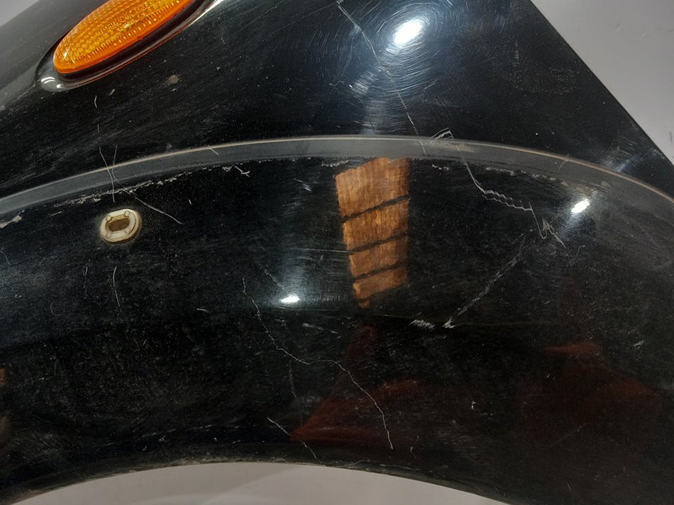 Guarda-lamas frontal esquerdo | Nissan Navara Pick-Up (D40M)